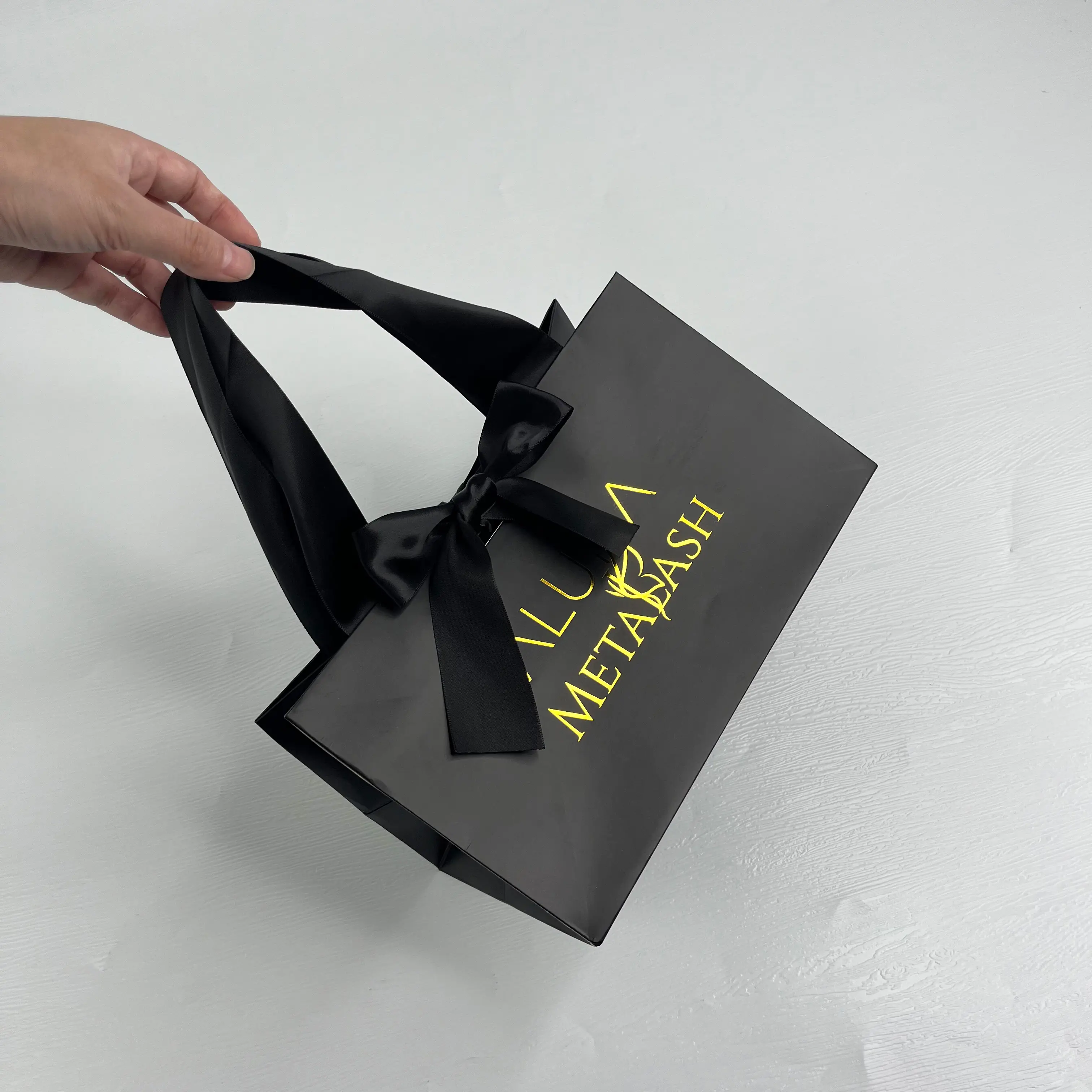 Custom luxury black paper bag with gold foil logo printed