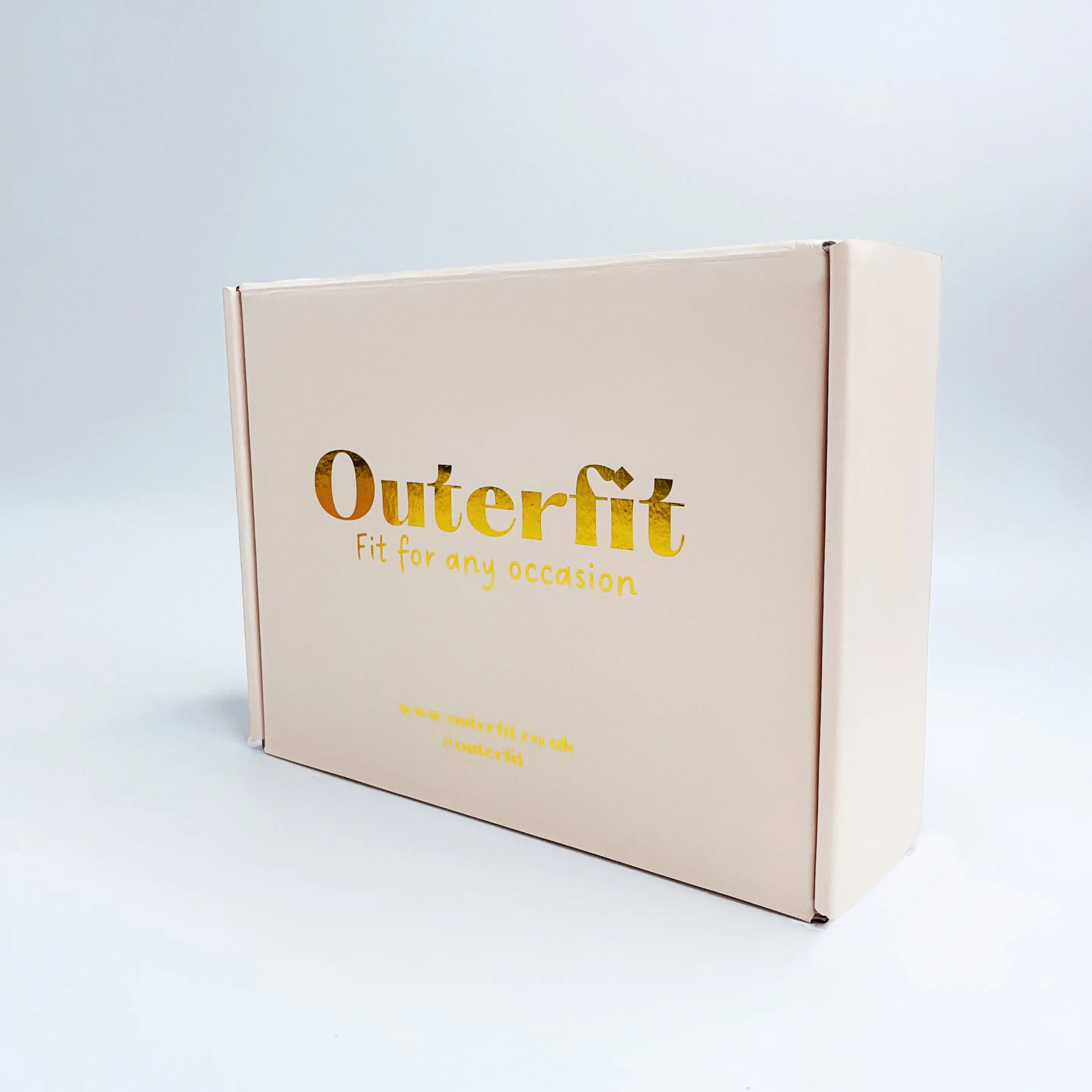 Peach paper mailer box with gold foil logo