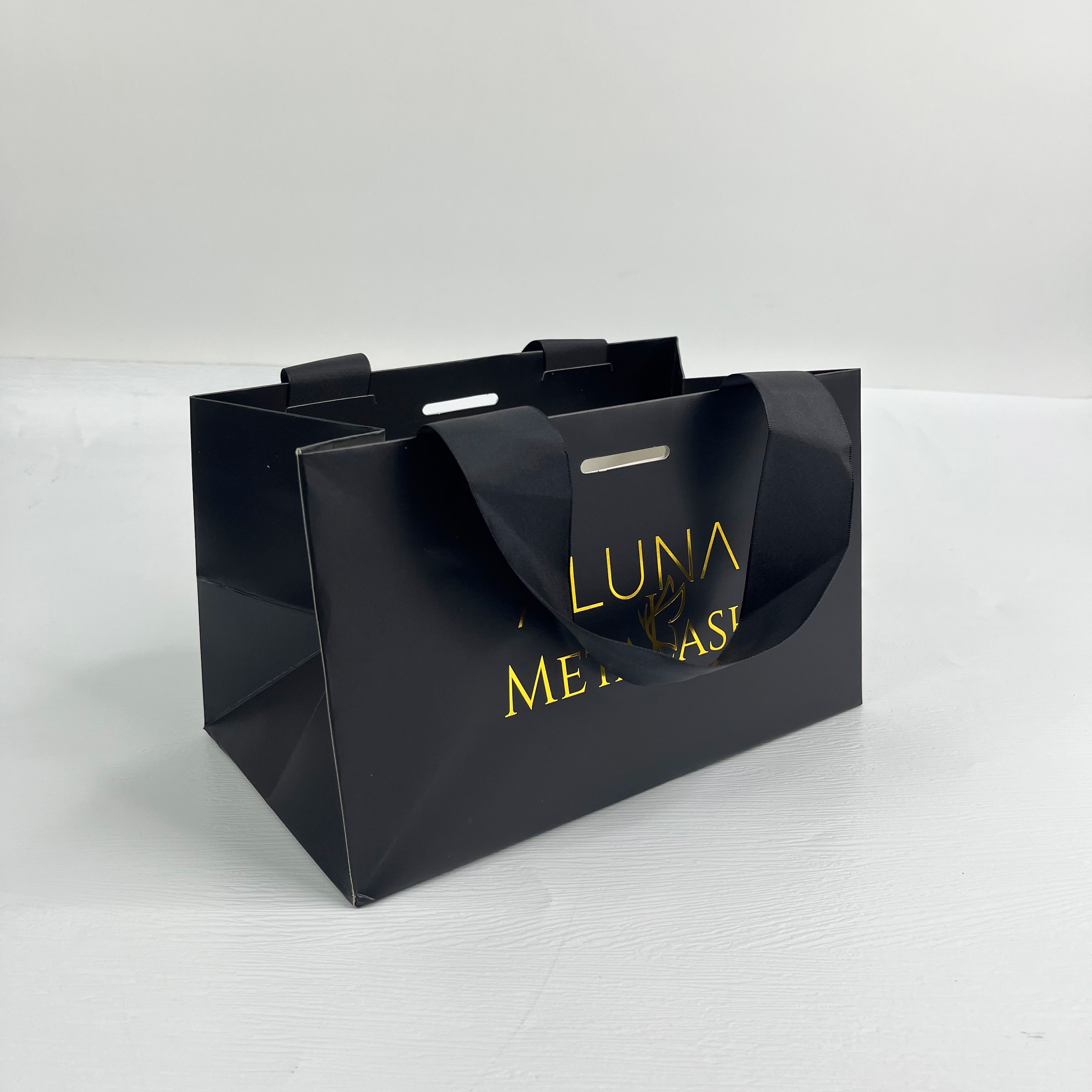 Custom luxury black paper bag with gold foil logo printed